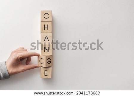 Wooden cubes with inscriptions: chance and change. Changes and new chances in a person's life Royalty-Free Stock Photo #2041173689
