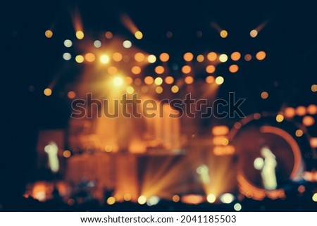 Defocused entertainment concert lighting on stage, blurred disco party. Royalty-Free Stock Photo #2041185503