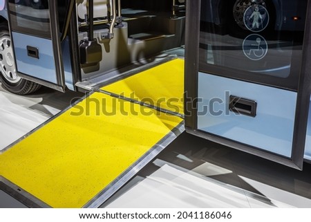 platform for wheelchairs, prams, elderly people in the cabin of a modern and comfortable city bus or electric bus