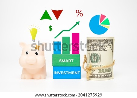 A picture of pig, fake money and smart investment word with common finance symbol