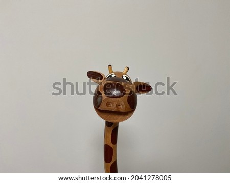 Giraffe wood toy in a white background