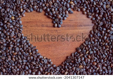 Image of a heart on coffee beans.