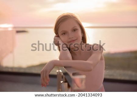 Portrait of a young ballerina against the sunset.