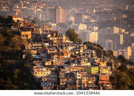 Beautiful sunrise view to favela on hillside in Rio de Janeiro Royalty-Free Stock Photo #2041338446