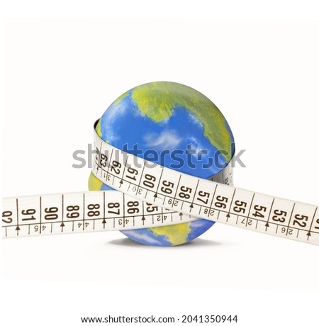 Measuring tape on planet earth globe on white background. ( the planet earth globe is a physical model made and paint by hand by the photographer )
