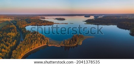 Aerial view of Plateliai lake, the biggest lake in Samogitia. It is the central attraction in the Zemaitija National Park. It has seven islands and one of them housed a castle. Royalty-Free Stock Photo #2041378535