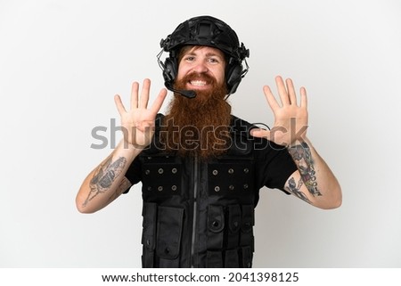 Redhead SWAT isolated on white background counting nine with fingers