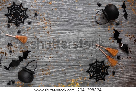 autumn stylish halloween decoration flatlay. copy space. top view. on a gray wooden background