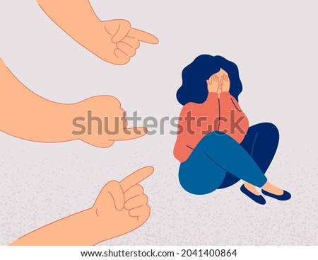 Sad girl suffers from psychological abuse from her peers. Weeping woman surrounded by hands with index fingers pointing at her. Public censure and victim-blaming. Bullying concept. Royalty-Free Stock Photo #2041400864