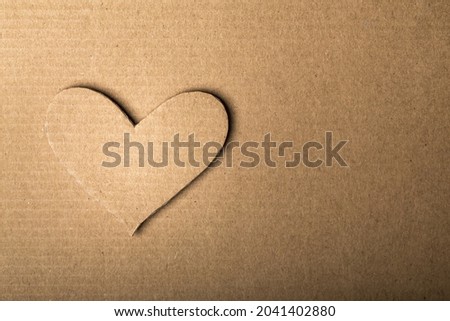 Cardboard Heart on the desk. Love Concept