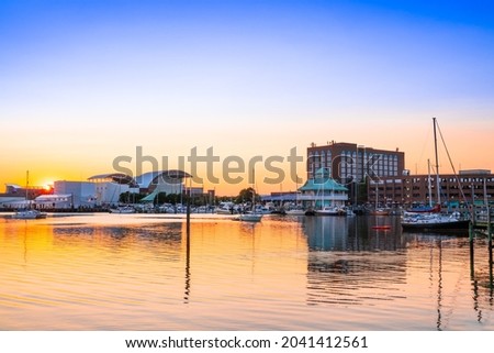 View of Hampton Virginia downtown waterfront district seen at sunset under colorful sky Royalty-Free Stock Photo #2041412561