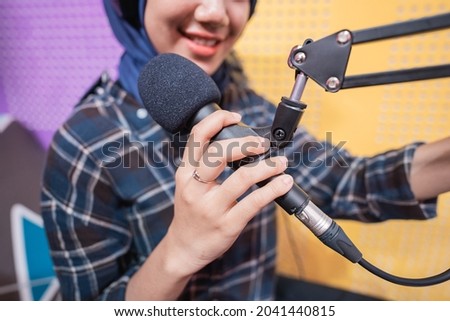 Close-up image of microphone in podcast studio.
