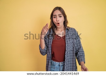 a beautiful woman with waving hand gesture when spiciness with copyspace Royalty-Free Stock Photo #2041441469