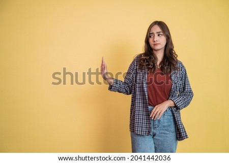 attractive woman with refusing offer gesture pose with copyspace