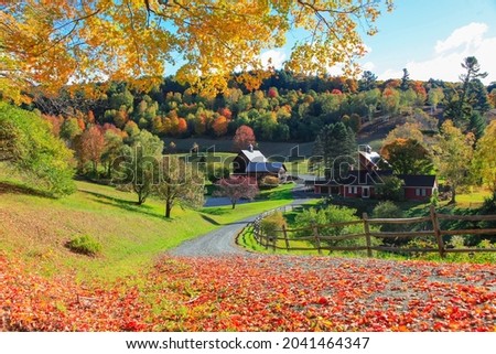 Barn in Vermont country side surrounded by autumn trees and foliage