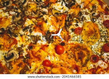 Closeup image of italian pizza with different ingredients. Full frame pizza picture.
