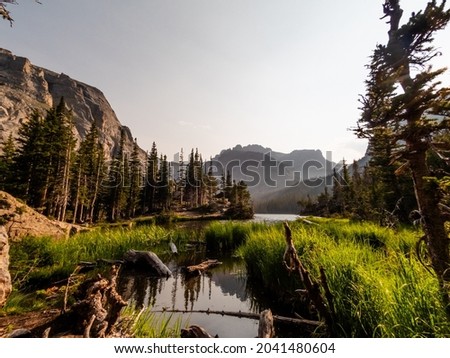 Colorful scene of alpine lake at sunset in the Rockies.