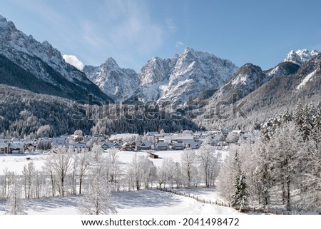 Kranjska Gora town in Slovenia at winter with mountains in the background Royalty-Free Stock Photo #2041498472