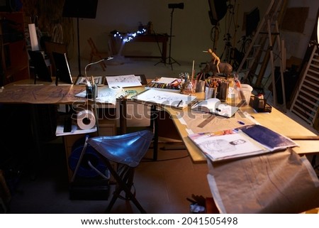 Creative artist workplace room no people hobby. Interior of contemporary arts studio with unfinished picture and painting stuff near by