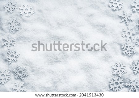 Christmas decorations on white snowy background. Holiday concept.