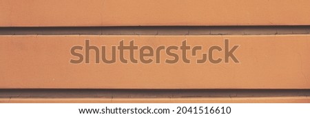 Decorative elements on the wall. Rough painted surface. Empty place for text, images and ads. Wide panoramic texture for background and design.