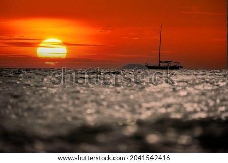 Sailing yacht to watch the big sun set