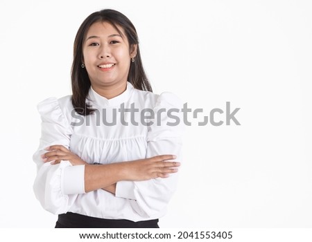 Portrait of young Asian woman wearing white formal shirt smiling with confident. Isolated.