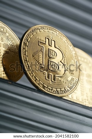 
Gold bitcoin cryptocurrency coin on an abstract background.