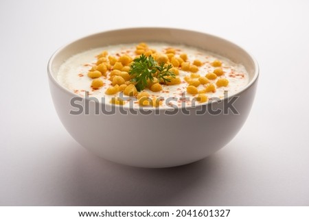 Boondi raita is a North Indian side dish variety made with spiced yogurt and boondi or crisp fried gram flour balls Royalty-Free Stock Photo #2041601327