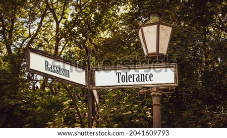 Street Sign the Direction Way to Tolerance versus Rassism