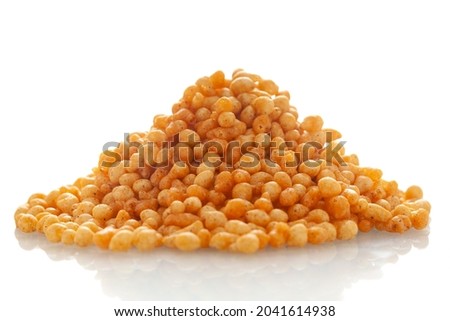 Close-up of crunchy masala boondi Indian namkeen (snacks), Indian spicy snacks (Namkeen), in a pile or heap, isolated over white background Royalty-Free Stock Photo #2041614938
