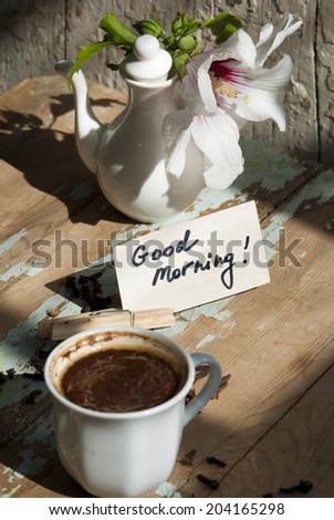 Pictures of sunny summer morning with beautiful flower, delicious turkish coffee on a rusted old table with decorations. 