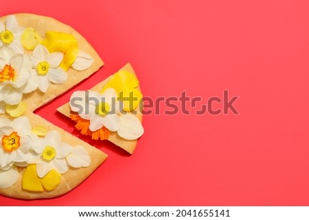Creative composition with tasty pizza and narcissus flowers on color background