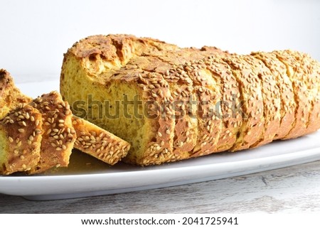 Chia bread, sliced, rich in omega three, healthy, beneficial for our body and characteristic of its yellow color and spongy texture. Royalty-Free Stock Photo #2041725941