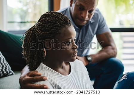 Father consoling his depressed daughter