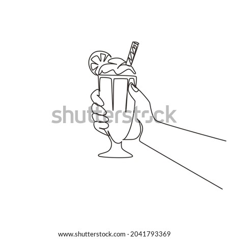 Continuous one line drawing hand holds glass milkshake with whipped cream. Cold soft drink for summer. Sweet beverage. Tasty and yummy fast food. Single line draw design vector graphic illustration