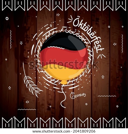Balloon with flag of Germany on a wooden background Oktoberfest