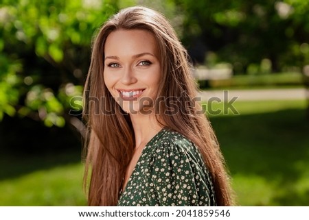 Photo of cheerful nice lady shiny white smile look camera enjoy day wear green dress nature park garden outdoors