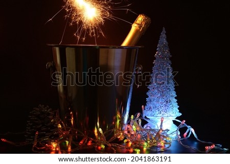 Champagne bottle with bengal fire. New Year concept