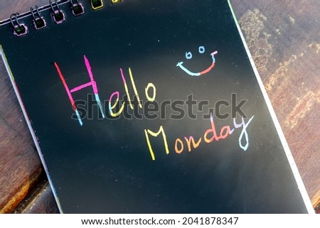 Hello Monday world handwrite on notebook