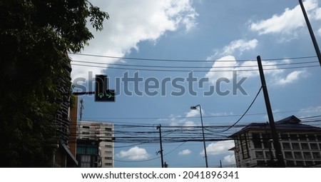 Classic urban scene in thailand ; Traffic light and electrical wire on city street , chiang mai north of thailand