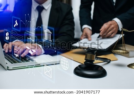 Law and Legal services concept, Lawyer businessman team working at the table office, Law interface icons. Blurred background.