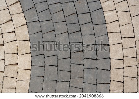 Fragment of paving slabs in black and gray