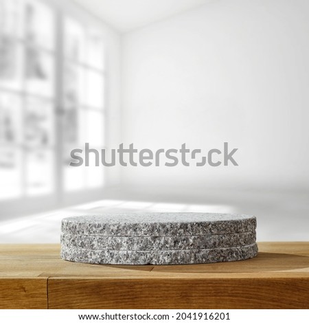 Wooden desk of free space and blurred background of window. 