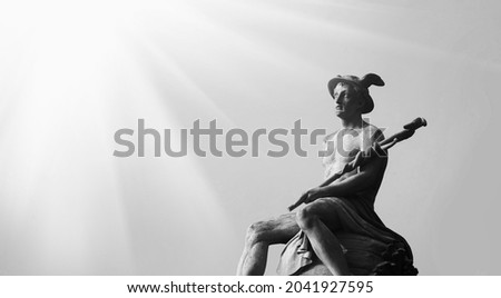 Ancient statue of antique god of commerce, merchants and travelers Hermes (Mercury). Black and white image. Royalty-Free Stock Photo #2041927595