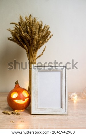 Portrait frame mock up with dried flowers on wooden table. High quality photo