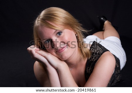 Pretty Young Blond German girl over black background