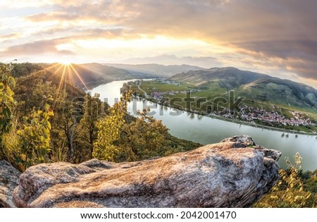 Panorama of Wachau valley (Unesco world heritage site) with Danube river at colorful sunset against Duernstein village in Lower Austria, Austria Royalty-Free Stock Photo #2042001470