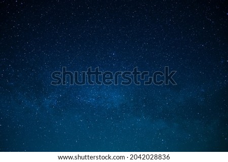 Starry night sky. Milky Way. Twinkling stars. Mysterious, majestic beauty, silence. Background. Texture. Wallpaper. Minimalism. There are no people in the photo. Astronomy, astrography, space.