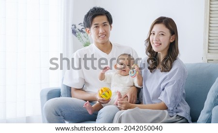 Young Asian family at home
